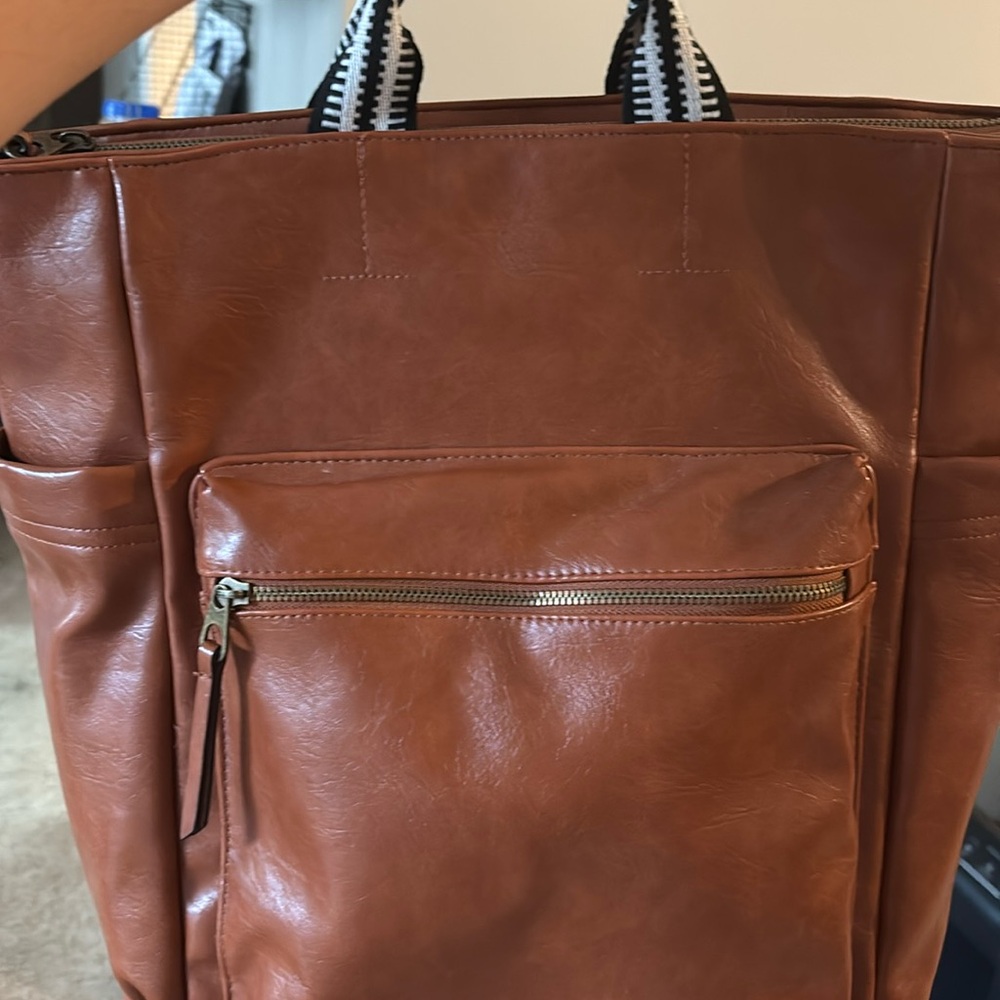 Travel backpack with laptop sleeve and 2 exterior slip pockets.